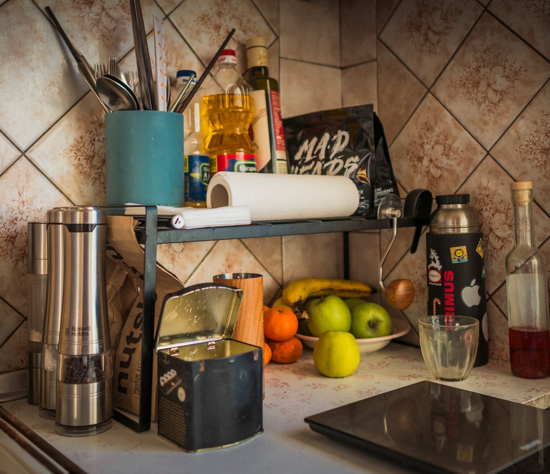 Kitchen counter with fruit, spices, and utensils