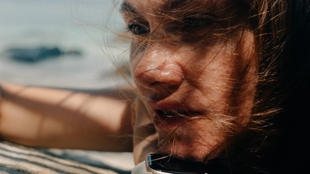 Close-up of a woman's face with windblown hair